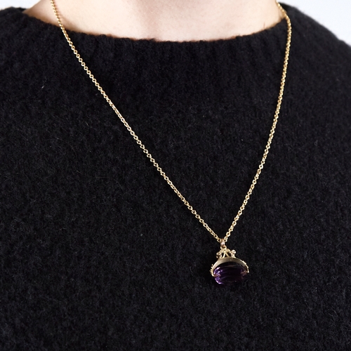 1326 - A late 20th century 9ct gold amethyst swivel fob pendant necklace, on unmarked gilt metal chain, pen... 