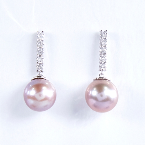 1332 - A modern pair of 14ct white gold pink South Sea pearl and diamond line earrings, total diamond conte... 