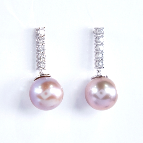 1332 - A modern pair of 14ct white gold pink South Sea pearl and diamond line earrings, total diamond conte... 