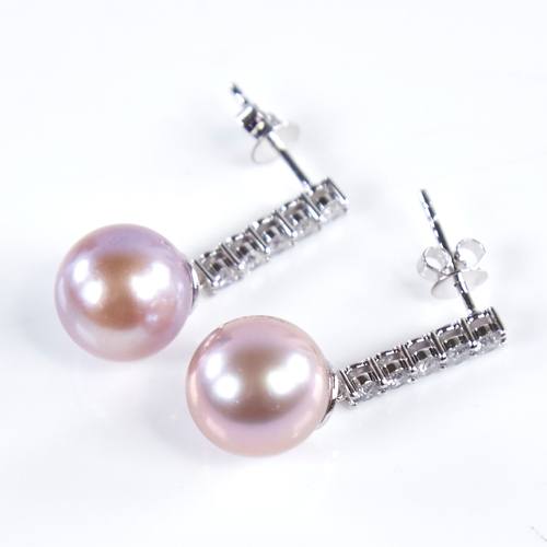 1332 - A modern pair of 14ct white gold pink South Sea pearl and diamond line earrings, total diamond conte... 