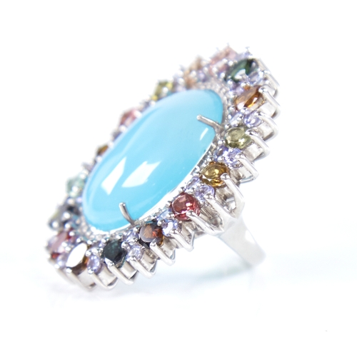 1333 - A large modern unmarked silver gem set ring, gemstones include cabochon turquoise, tourmalines and r... 