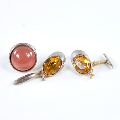 1336 - A pair of novelty unmarked white metal and citrine jockey cap cufflinks, cap length 32.5mm, and an u... 