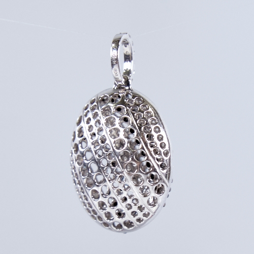 1337 - A modern 18ct white gold black and white diamond pendant, set with alternating stripes of round bril... 