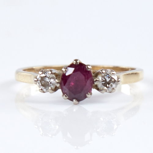 1338 - A mid-20th century 18ct gold 3-stone ruby and diamond ring, set with oval-cut ruby and round brillia... 