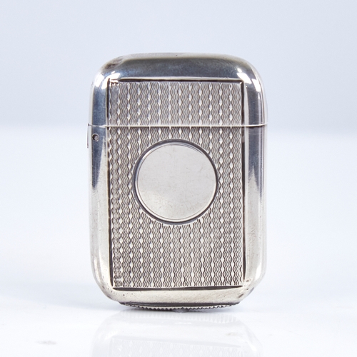 1342 - A Victorian silver Vesta case, rounded rectangular form with engine turned decoration, by Sampson Mo... 