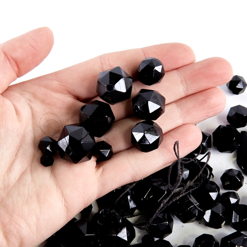 1345 - A group of faceted jet beads, largest diameter 21.2mm, 185g total