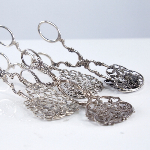 1351 - 4 pairs of Swedish silver pastry tongs, allover foliate decoration with pierced plates, largest leng... 