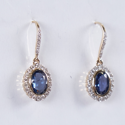 1358 - A modern pair of 14ct gold sapphire and diamond cluster drop earrings, central oval-cut sapphires su... 