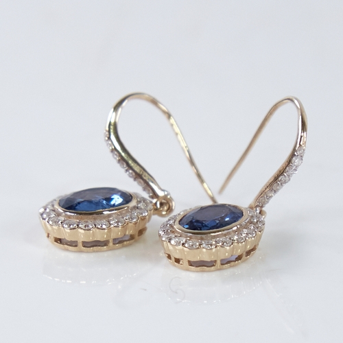 1358 - A modern pair of 14ct gold sapphire and diamond cluster drop earrings, central oval-cut sapphires su... 