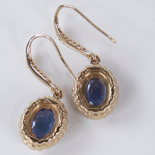 1358 - A modern pair of 14ct gold sapphire and diamond cluster drop earrings, central oval-cut sapphires su... 