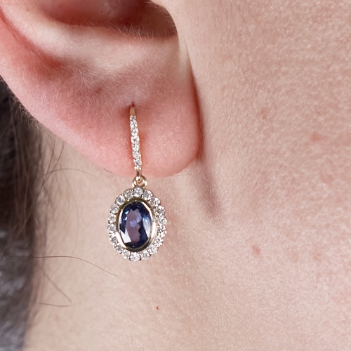 1358 - A modern pair of 14ct gold sapphire and diamond cluster drop earrings, central oval-cut sapphires su... 