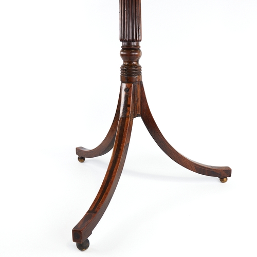 302 - A Regency rosewood and satinwood crossbanded telescopic table, with reeded centre column on tripod b... 