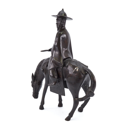 315 - A Chinese patinated bronze horse and rider, height 35cm