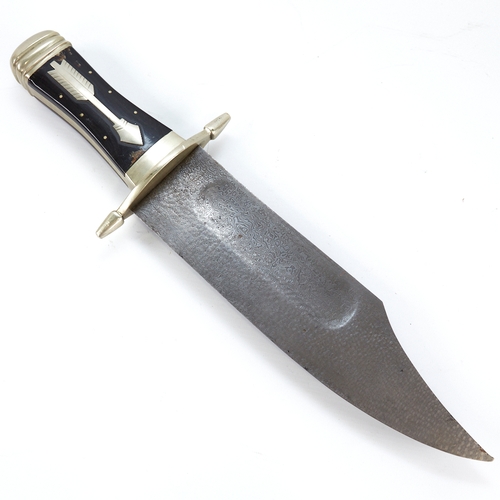 317 - A large hunting knife with damascus steel blade, and nickel cross hilt with horn grips, overall leng... 