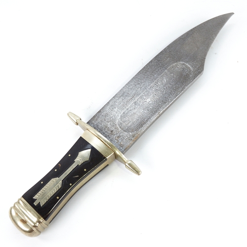 317 - A large hunting knife with damascus steel blade, and nickel cross hilt with horn grips, overall leng... 