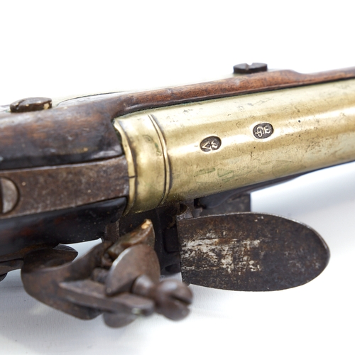 318 - A 19th century flintlock brass-barrelled blunderbuss, with mahogany stock, impressed marks to the ba... 