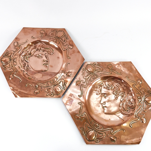 319 - A pair of Art Nouveau copper plaques, relief embossed portrait panels in scroll surrounds, 37cm acro... 