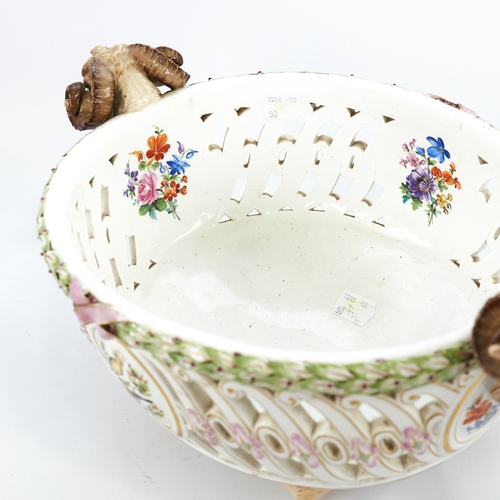 322 - A Meissen Porcelain table centre basket, circa 1900, with ram's head handles, pierced surround and h... 