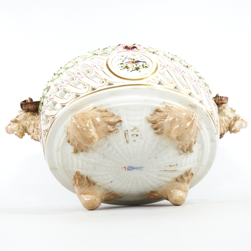 322 - A Meissen Porcelain table centre basket, circa 1900, with ram's head handles, pierced surround and h... 