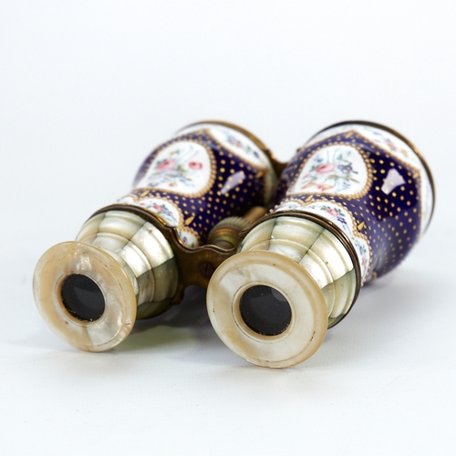 324 - A pair of French enamelled opera glasses, hand painted floral decoration on blue and gilt ground, wi... 