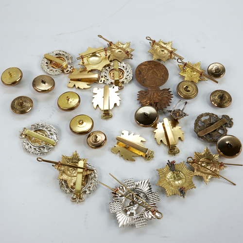 326 - A group of military badges and buttons