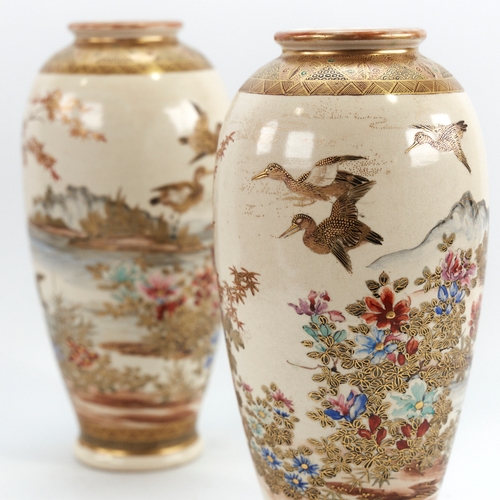 329 - A pair of Japanese Satsuma porcelain vases, with painted and gilded birds and trees, signed under ba... 