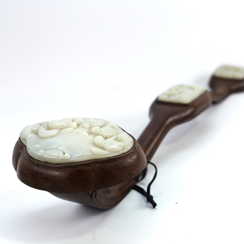 332 - A Chinese hardwood rui sceptre with 3 inset relief carved jade panels, length 50cm, largest jade pan... 