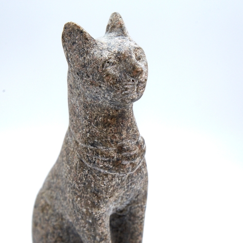 334 - An Egyptian style carved stone seated cat, height 21cm