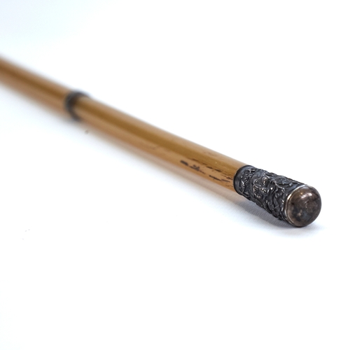 337 - A late 19th century Chinese rhino horn riding crop, unmarked white metal top with relief moulded fig... 