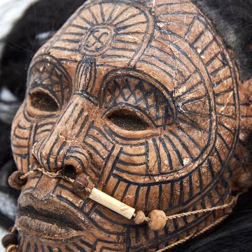 338 - An unusual composition Tribal head wall mask, with painted face and real hair, life-size, probably m... 