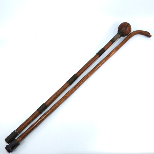 339 - A hardwood Tribal club with metal wirework-bound handle, length 80cm, and a walking stick with carve... 