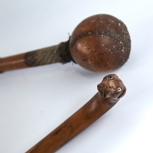 339 - A hardwood Tribal club with metal wirework-bound handle, length 80cm, and a walking stick with carve... 