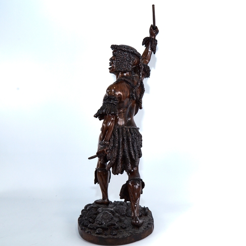 340 - A carved and stained hardwood figure of a Tribal man, height to top of head 52cm, modern