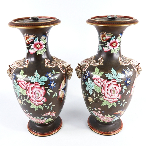 350 - A pair of 19th century porcelain vases and covers, with enamel decoration and gilded ram's head hand... 