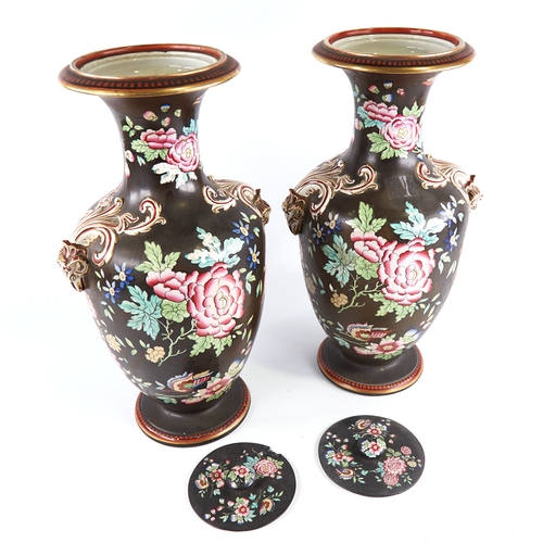 350 - A pair of 19th century porcelain vases and covers, with enamel decoration and gilded ram's head hand... 