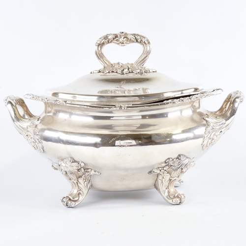 351 - A large silver plated 2-handled soup tureen and cover, with cast foliate decoration on scrolled acan... 