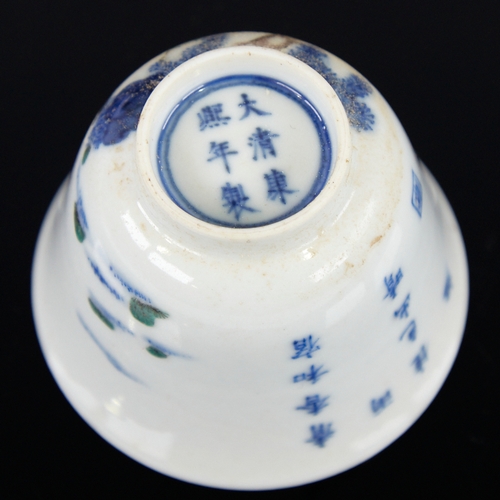 368 - A Chinese porcelain tea bowl, with painted blossom tree and text, 6 character mark, diameter 6.5cm, ... 