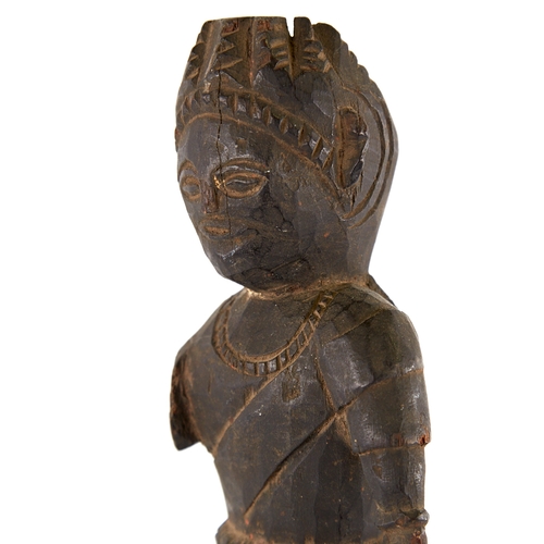 389 - An Indian carved and stained wood figure on metal stand, overall height 47cm