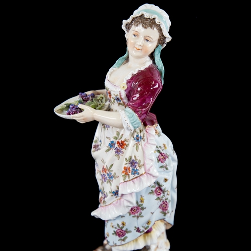 390 - A German porcelain figure of a country girl, height 24cm