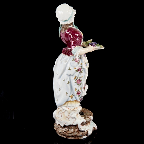 390 - A German porcelain figure of a country girl, height 24cm