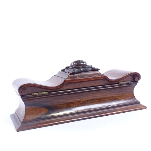 242 - A mid-19th century mahogany sarcophagus-shaped pen box, with shaped and scrolled hinged lid and sati... 