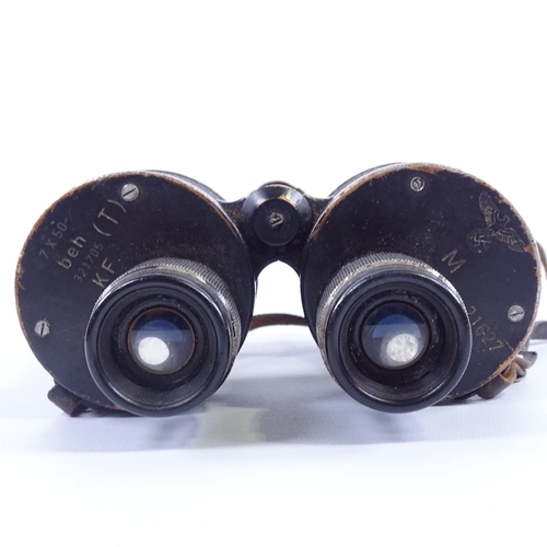 247 - A pair of German Second World War Period military binoculars, 7x50, with military crest