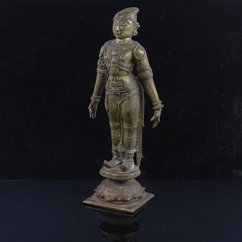 250 - An Indian bronze figure of God, probably 17th or 18th century, wearing detailed dress, height 23cm