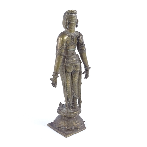 250 - An Indian bronze figure of God, probably 17th or 18th century, wearing detailed dress, height 23cm