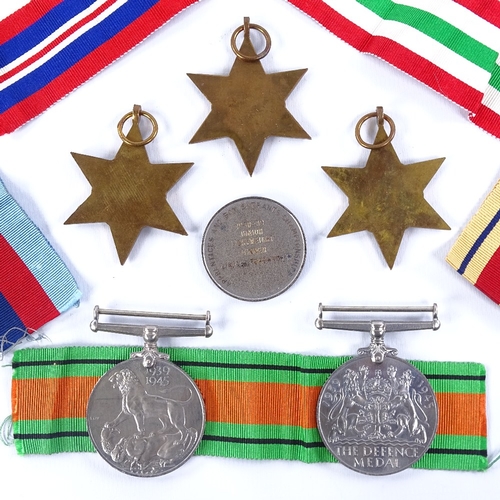 261 - A group of 5 unnamed Second War Service medals and ribbons, and a nickel plate Royal Airforce Boxing... 