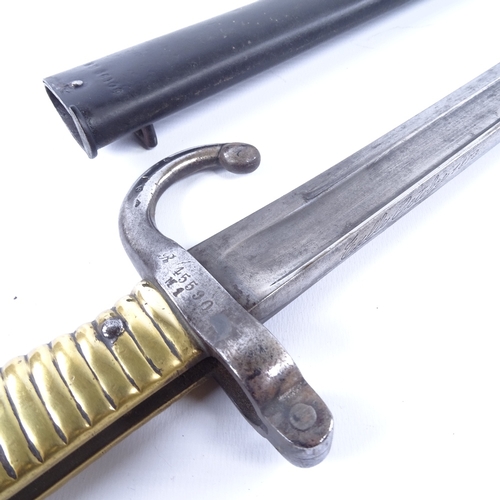 294 - A 19th century French brass-hilted sword bayonet with metal scabbard