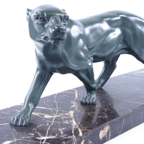 299 - Louis-Albert Carvin (French 1860 - 1951), a green patinated spelter prowling panther, on original bl... 