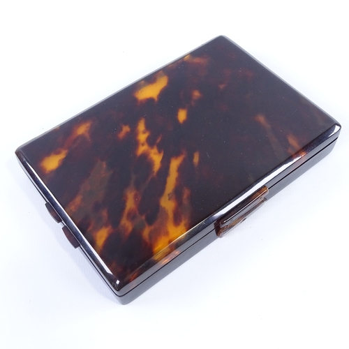 205 - A tortoiseshell travelling toilet case, early 20th century, the interior fitted with fold-out mirror... 