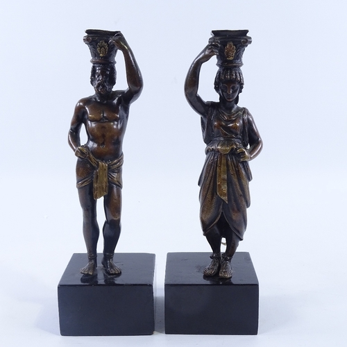 227 - A pair of patinated bronze candleholders, in the form of Greek Classical figures, late 19th century,... 