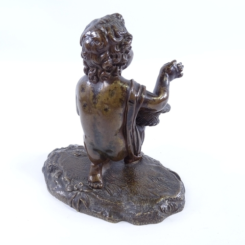 229 - 19th century patinated bronze figure of a boy holding a basket, unsigned, height 12cm, width 12cm